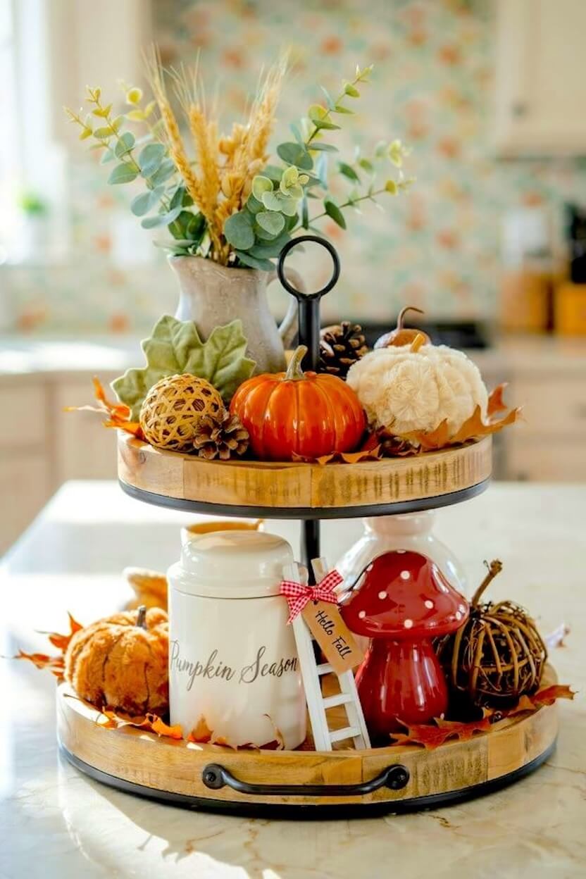 A glossy red mushroom figurine, a plush white pumpkin, woven rattan spheres, and a pumpkin season ceramic jar embodying a cozy cottagecore autumn aesthetic.